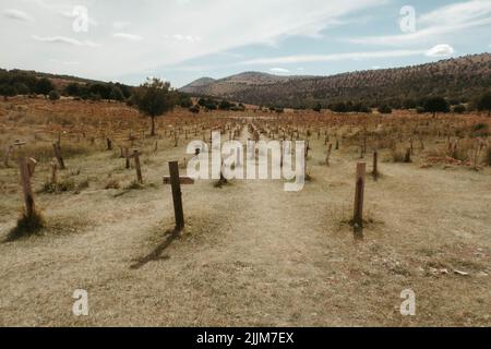 A large number of crosses stuck in the ground in Sad Hill Cemetery in the province of Burgos, Spain Stock Photo