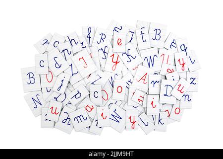 Pile of letters from a notebook on white background. Typography background composition. Stock Photo