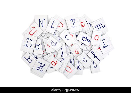 Pile of letters from a notebook on white background. Typography background composition. Stock Photo