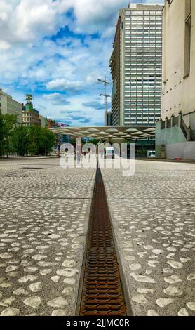 Brussels, Belgium, 08 June 2022, Empty square floor and modern city skyline with buildings in Brussels at noon. High quality photo Stock Photo