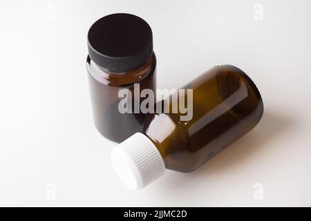 medical jars with dark glass caps for tablets Stock Photo