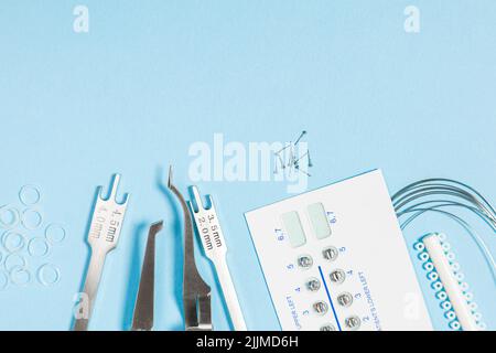 a set of special tools for an orthodontist to install braces for a ...
