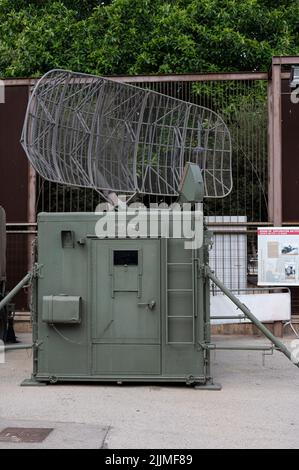 A vertical shot of a military mobile radar antenna group in the street. Stock Photo