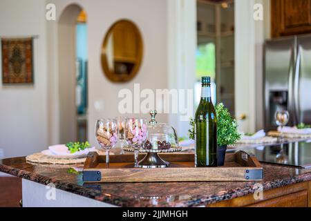 A beautiful interior design of a kitchen with a set dining table Stock Photo
