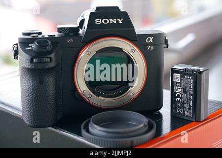 A closeup shot of a Sony A7ii Mirrorless Camera Body with sensor exposed Stock Photo