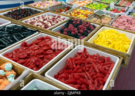 A frame of multi-colored colorful rubber bands for hair, combs and hair  clips on a black background.Copy space Stock Photo - Alamy