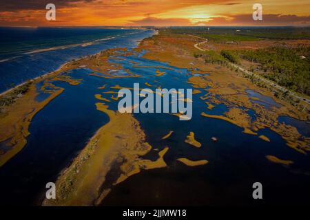 An aerial shot of Captiva Island and Sanibel Island with a scenic sunset background, Florida Stock Photo