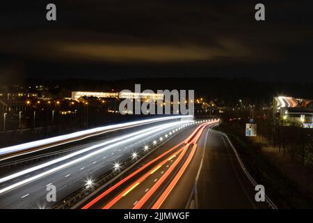 A closeup of long exposure with light trails from cars Stock Photo