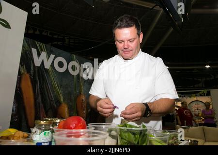 A man working a stand at Food and Wine Expo in Johannesburg, South Africa Stock Photo
