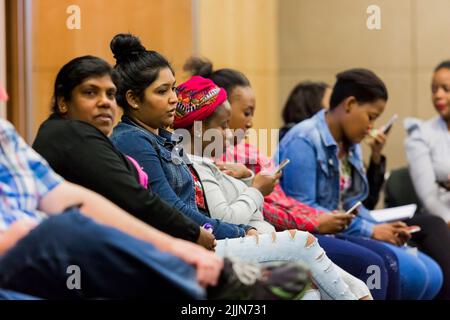 The diverse adult students attending a class on finance in Johannesburg, South Africa Stock Photo