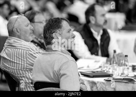 A grayscale of delegates attending sales convention at a large conference center in Johannesburg, South Africa Stock Photo