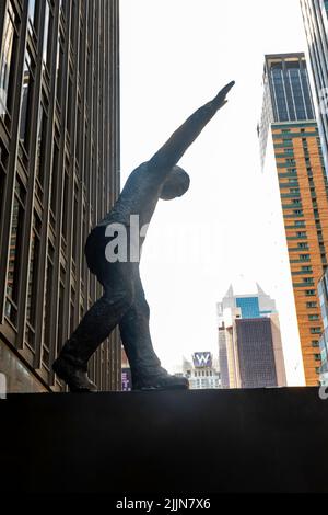 Walking the Tightrope, located at the entrance of 1700 Broadway, 2022, NYC, USA Stock Photo