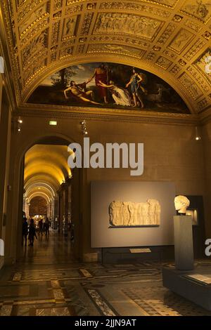 A vertical shot of the inside of the Louvre museum in Paris, France Stock Photo