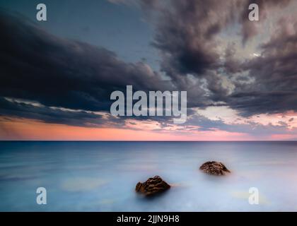 The view of the sea and rocks. Long exposure landscape. Stock Photo
