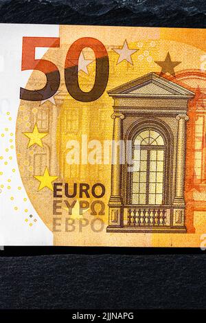 Selective focus on detail of euro banknotes 50 euro isolated. World money concept, inflation and economy concept Stock Photo