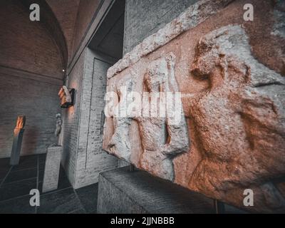 The beautiful shot of a stone curved facade decoration depicting women Stock Photo