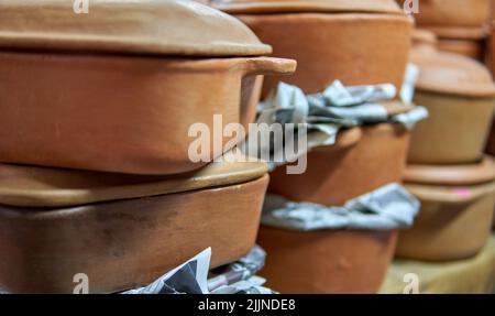 Pottery for sale. clay pots on top of each other in a market in mendoza, argentina. Selective focus Stock Photo