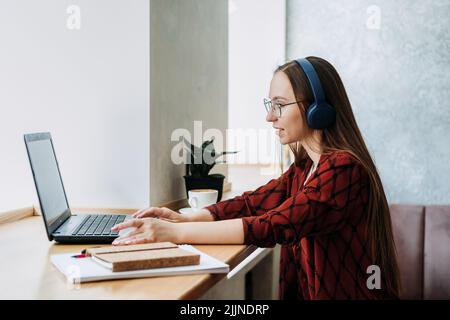 Outsourcing IT Projects, remote work, young professionals. female young programmer, developer working Stock Photo