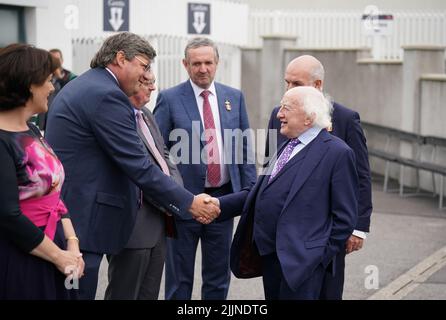 President of Ireland Michael D. Higgins (right) meets members of the Galway racing committee during day three of the Galway Races Summer Festival 2022 at Galway Racecourse in County Galway, Ireland. Picture date: Wednesday July 27, 2022. Stock Photo