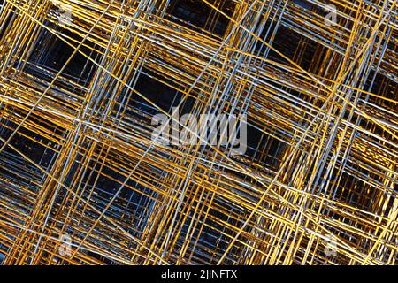 Steel rebars for reinforced concrete, welded steel reinforcement mesh texture in construction site, top view Stock Photo
