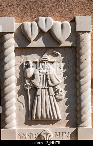 Base Relief at The Santo Nino Chapel at Sanctuario de Chimayo, Chimayo, New Mexico, USA Stock Photo