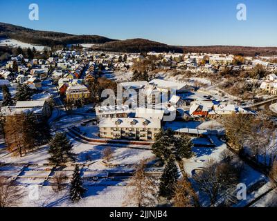 An aerial shot of Ilsenburg in winter on a sunny day in Harz, Saxony-Anhalt,Germany Stock Photo