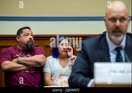 Jazmin Cazares, center, whose nine year-old sister Jacklyn Cazares, was one of the children killed by a gunman at Robb Elementary School in Uvalde, Texas, is seated next to her father Javier Cazares, left, during a House Committee on Oversight and Reform hearing “Examining the Practices and Profits of Gun Manufacturers” in the Rayburn House Office Building in Washington, DC, July 27, 2022. Credit: Rod Lamkey/CNP /MediaPunch Stock Photo
