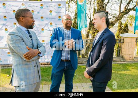 Johannesburg, South Africa - August 15, 2018: VIP guests mingling at outdoor social event Stock Photo