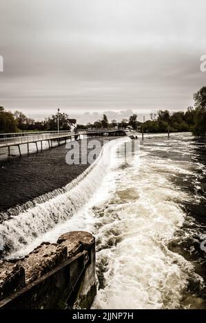 A vertical shot of the Hambleden Lock situated on the River Thames in England Stock Photo