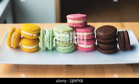 A closeup shot of colorful macaroons on a plate Stock Photo