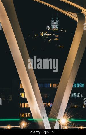 A vertical distant view of the Postlingberg pilgrimage church at night ...