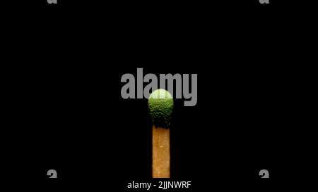 Match Stick on black background, unlit fire starter studio wood burn burning flammable flame simple camping dangerou Stock Photo