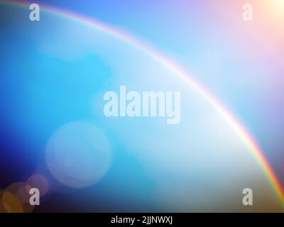 Bright blue background image with a rainbow blurred pattern. Stock Photo