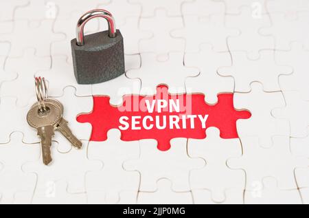 Business and security concept. On puzzles there is a lock and keys, on a red surface there is an inscription - VPN security Stock Photo