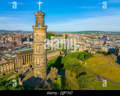 Nelson Monument on Calton Hill and St. Andrew's House on Princes Street aerial view in New Town of Edinburgh, Scotland, UK. New Town Edinburgh is a UN Stock Photo