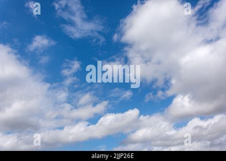 White cumulus clouds and blue sky, Washington, Tyne and Wear, England, United Kingdom Stock Photo