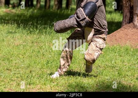 Cynologist with a sleeve for training aggression of dogs. High quality photo Stock Photo