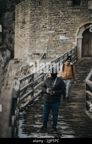 A Two young males taking photos outdoors Stock Photo