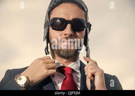 businessman in suit and pilot hat get ready Stock Photo