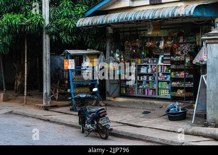 A view of an Outside a general store with a moped parked in Hpa-An, Myanmar, South East Asia Stock Photo