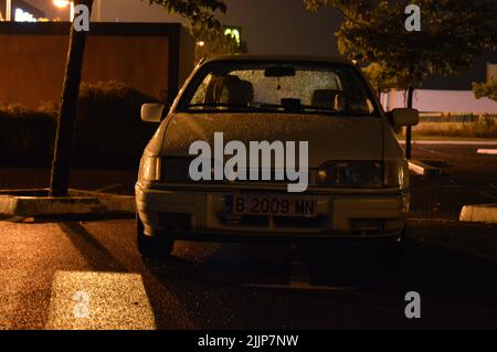 A view of parked Ford Sierra classic street car at night Stock Photo