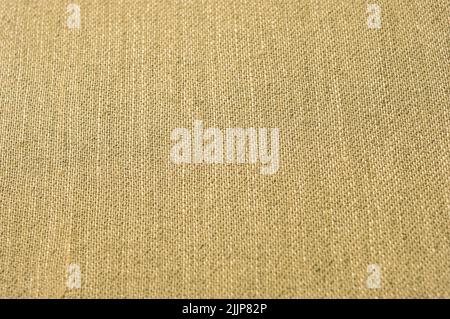A detailed closeup of an old, brown linen cloth for creative background Stock Photo