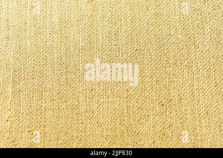 A detailed closeup of an old, brown linen cloth for creative background Stock Photo