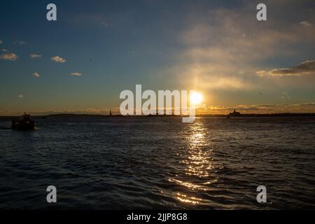 A scenic view of the sun rays reflected on the ocean Stock Photo