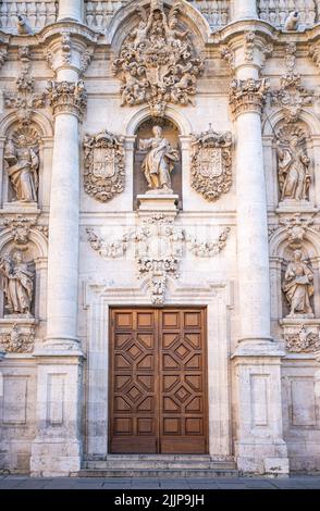 A majestic and ornate eighteenth-century baroque style door of the University of Valladolid, Spain Stock Photo