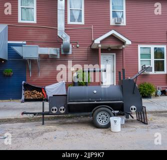 NEW ORLEANS, LA, USA - JULY 9, 2022: Heavy duty smoker in use outside Piece of Meat Restaurant in Mid City Stock Photo