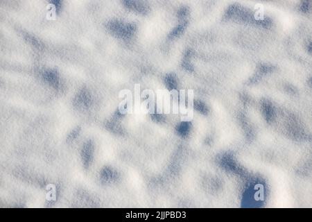 A top view of snow under sunlight Stock Photo