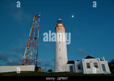 A low angle shot of a lighthouse in the evening Stock Photo
