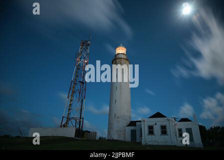 A low angle shot of a lighthouse in the evening Stock Photo