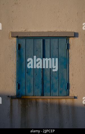 A blue minimal window from a small house in a small typical portuguese town, peniche. Stock Photo